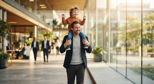 A parent carrying their child, moving forward together